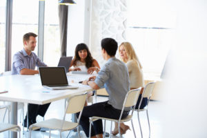 ACHI Fellows at an office meeting